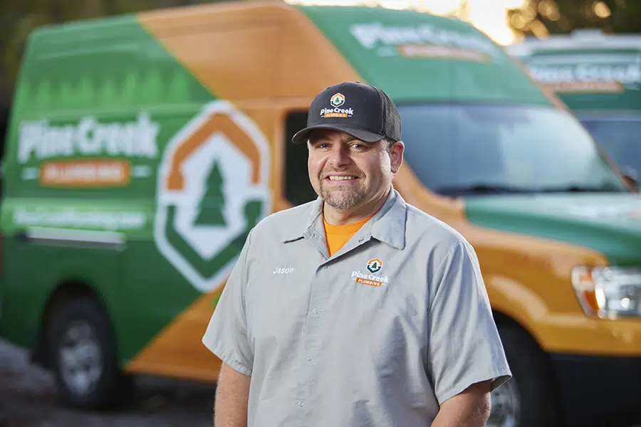 Pine Creek Plumbing owner smiling with truck in Wexford, PA