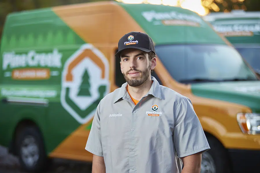 Pine Creek Plumber with van in background ready to serve Sewickley home