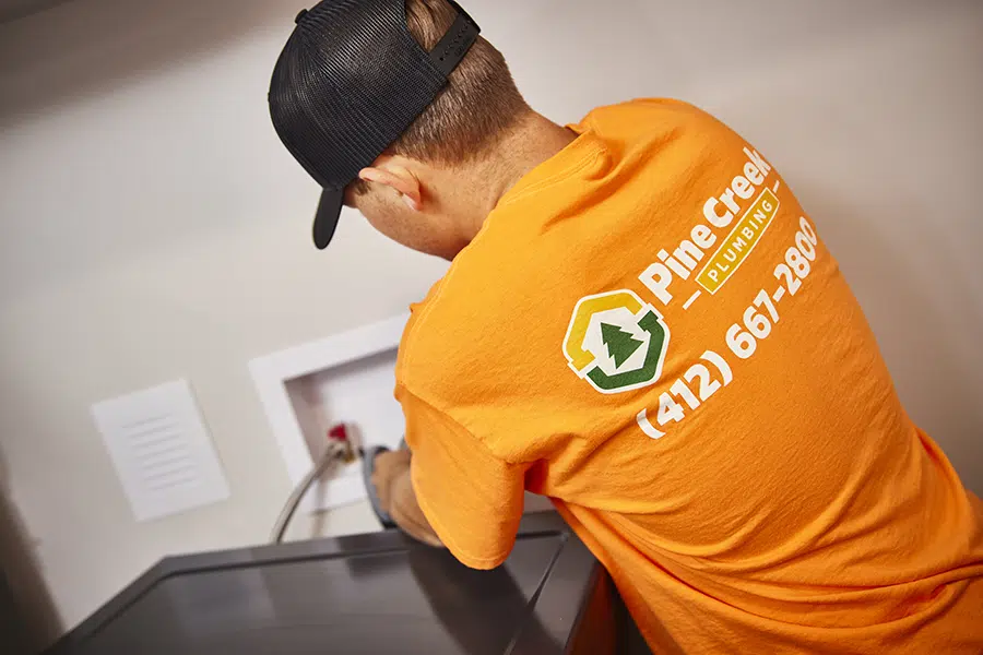 Pine Creek Plumber working inside Wexford, PA home