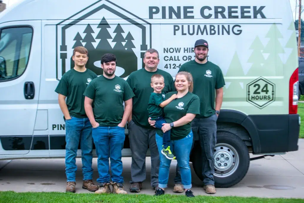 Pine Creek Plumbing team in front of business truck in Wexford.