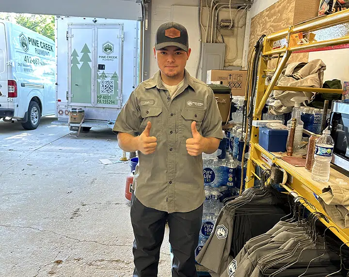 Pine Creek Plumbing tech with new shirt in Wexford.